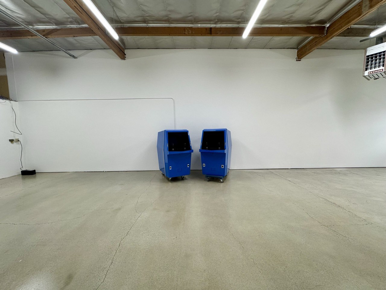 Museum gallery view; the cabinets are small in the wide composition. Optional preservation context, not a hero image.