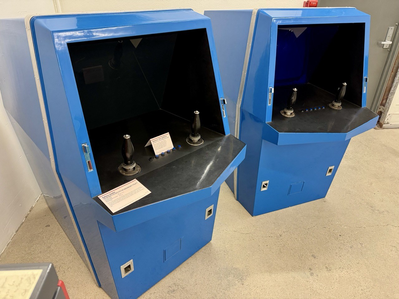 Oblique view of the later blue cabinets and controls. Reflections limit fine label reading.